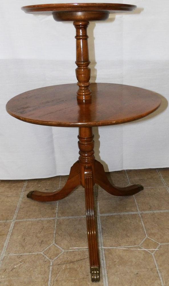 Walnut Two Tier Dumbwaiter: Walnut Two Tier Dumbwaiter . 27 1/4" H 18" Dia. ALL DESCRIPTIONS AND ANY CONDITION STATEMENT GIVEN BY LANGSTON AUCTION GALLERY ARE STRICTLY OPINIONS AND LANGSTON'S SHALL HAVE NO RESPONSIBILITY FOR ERR