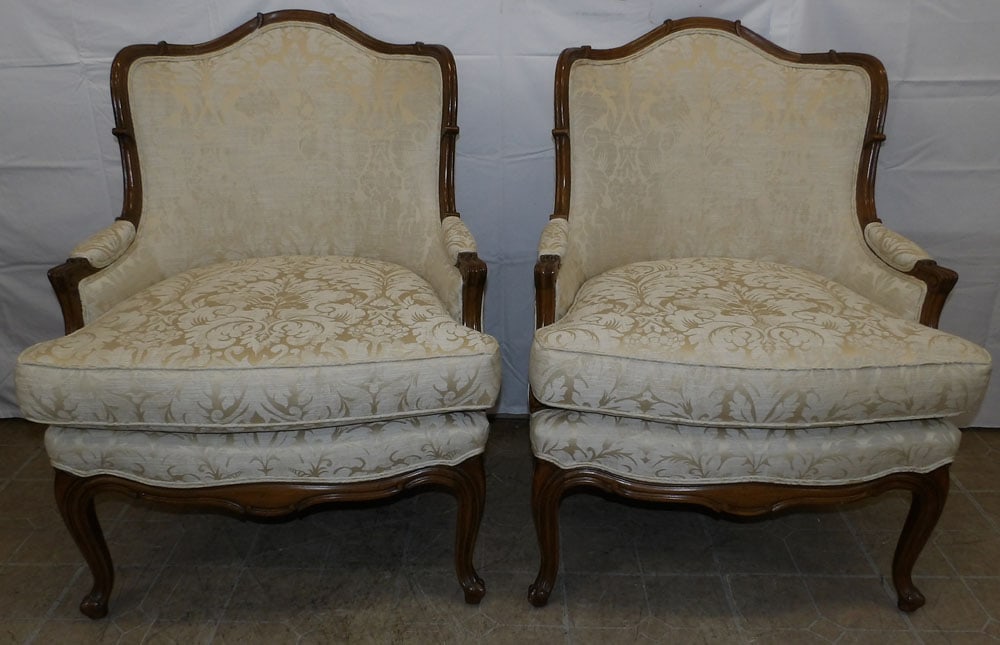 Pair of Carved Walnut & Upholstered Bergères: Pair of Carved Walnut & Upholstered Bergères . 38 1/4" H 29 1/2" W 30" D ALL DESCRIPTIONS AND ANY CONDITION STATEMENT GIVEN BY LANGSTON AUCTION GALLERY ARE STRICTLY OPINIONS AND LANGSTON'S SHALL