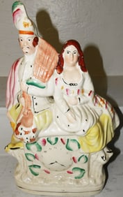 Antique Staffordshire Figure of Man & Woman Sitting on Clock