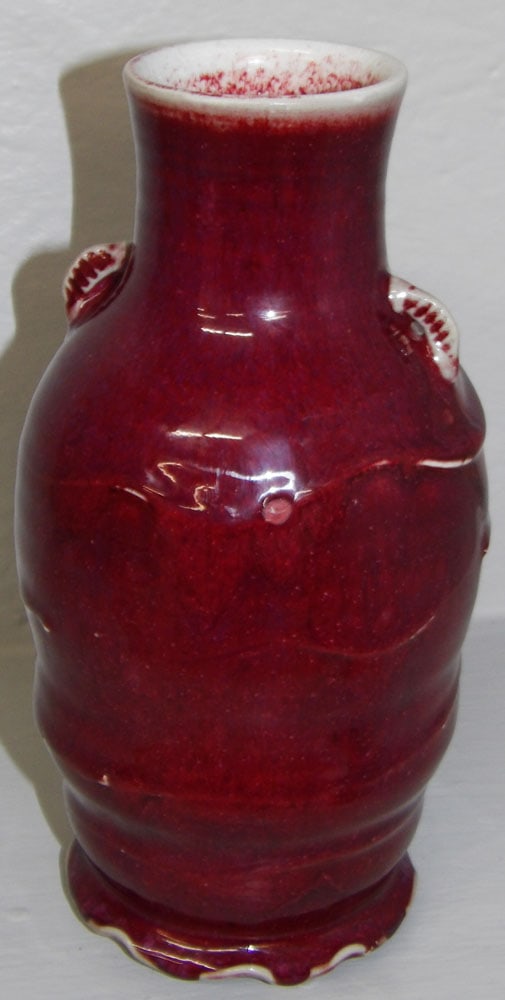 Chinese Style Sang De Boeuf Pottery Vase: Chinese Style Sang De Boeuf Pottery Vase . 9" H 4 1/4" Dia ALL DESCRIPTIONS AND ANY CONDITION STATEMENT GIVEN BY LANGSTON AUCTION GALLERY ARE STRICTLY OPINIONS AND LANGSTON'S SHALL HAVE NO RESPONSIBIL