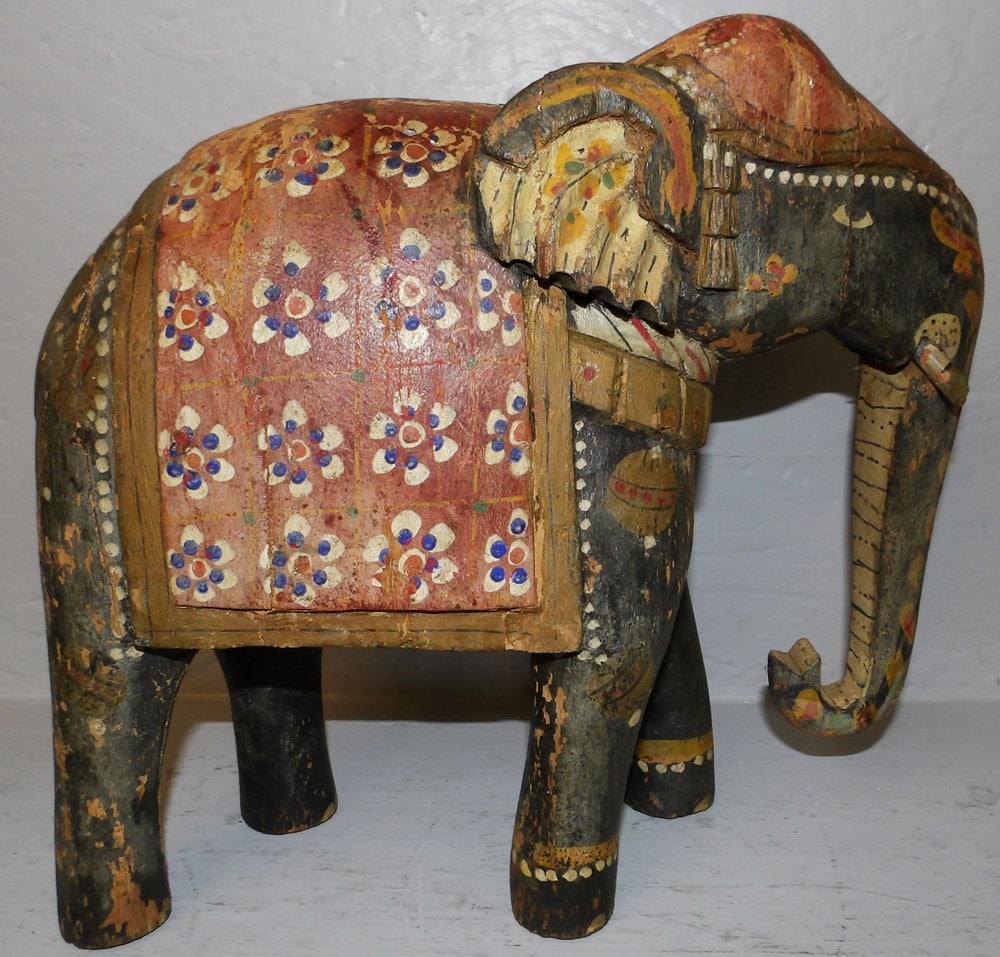 Hand Painted Wood Carved Figure Of Elephant: Hand Painted Wood Carved Figure Of Elephant. 12" H 13" W 5 1/2" D ALL DESCRIPTIONS AND ANY CONDITION STATEMENT GIVEN BY LANGSTON AUCTION GALLERY ARE STRICTLY OPINIONS AND LANGSTON'S SHALL HAVE NO RESP