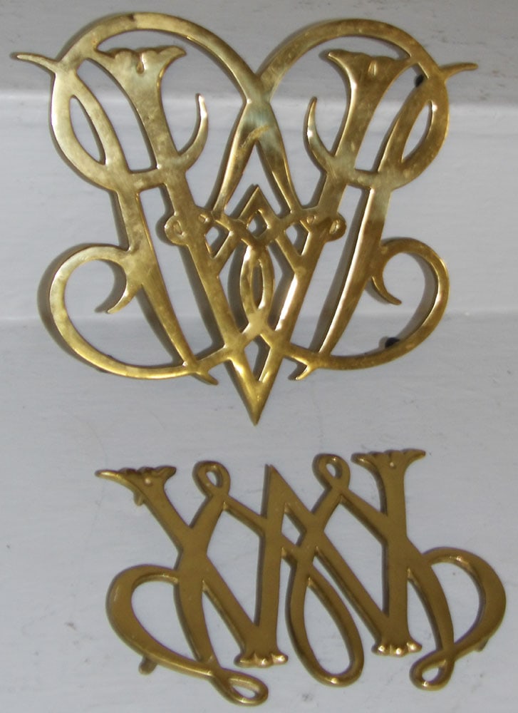 Two Brass Virginia Metalcrafters Trivets, (Queen Anne Cypher & William & Mary Cypher): Two Brass Virginia Metalcrafters Trivets, (Queen Anne Cypher & William & Mary Cypher). Up to 9" x 10 1/2" ALL DESCRIPTIONS AND ANY CONDITION STATEMENT GIVEN BY LANGSTON AUCTION GALLERY ARE STRICTLY OP