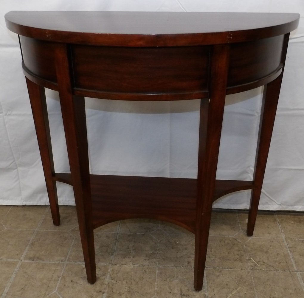 Mahogany Two Tier Demi Lune Console: Mahogany Two Tier Demi Lune Console . 30 1/4" H 31 3/4" W 14" D ALL DESCRIPTIONS AND ANY CONDITION STATEMENT GIVEN BY LANGSTON AUCTION GALLERY ARE STRICTLY OPINIONS AND LANGSTON'S SHALL HAVE NO RESPON