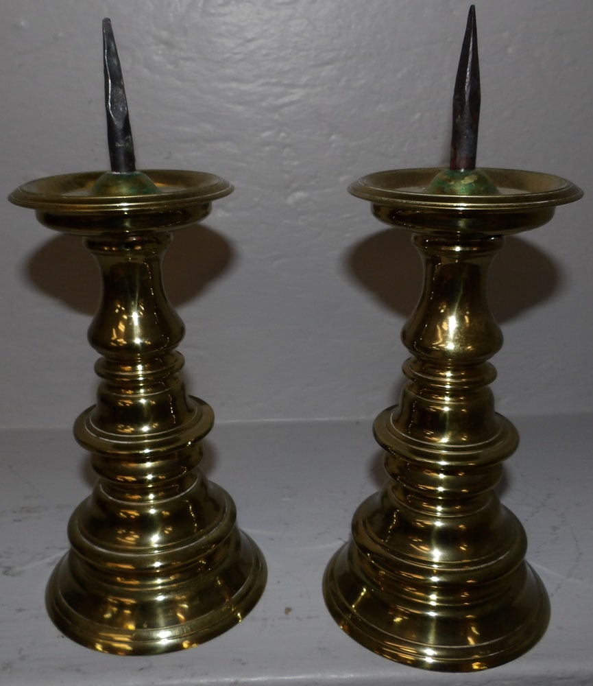 Pair of Brass Candlesticks by Virginia Metalcrafters: Pair of Brass Candlesticks by Virginia Metalcrafters . 10" H 4 1/4" Dia. ALL DESCRIPTIONS AND ANY CONDITION STATEMENT GIVEN BY LANGSTON AUCTION GALLERY ARE STRICTLY OPINIONS AND LANGSTON'S SHALL HAVE