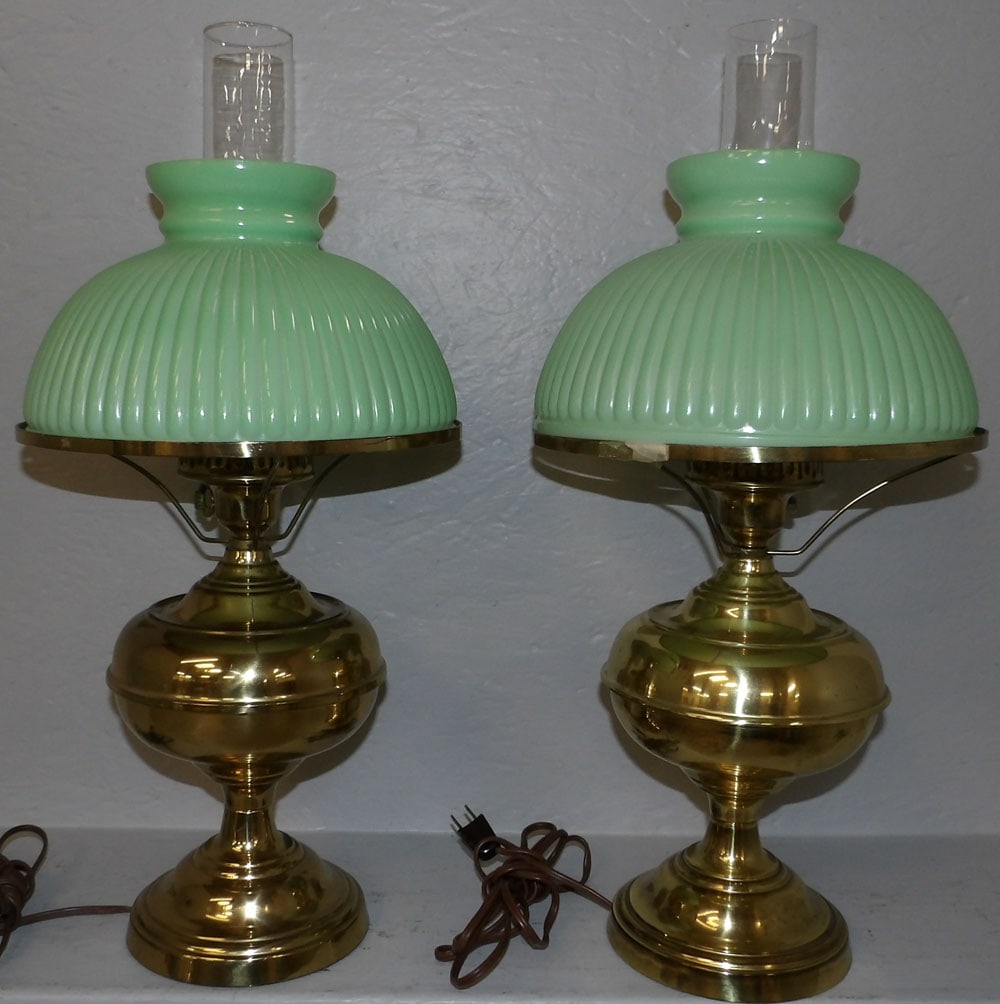 Pair of Brass Oil Lamps with Green Shades, Electrified: Pair of Brass Oil Lamps with Green Shades, Electrified. 21 1/2" H 10" Dia. ALL DESCRIPTIONS AND ANY CONDITION STATEMENT GIVEN BY LANGSTON AUCTION GALLERY ARE STRICTLY OPINIONS AND LANGSTON'S SHALL HAV