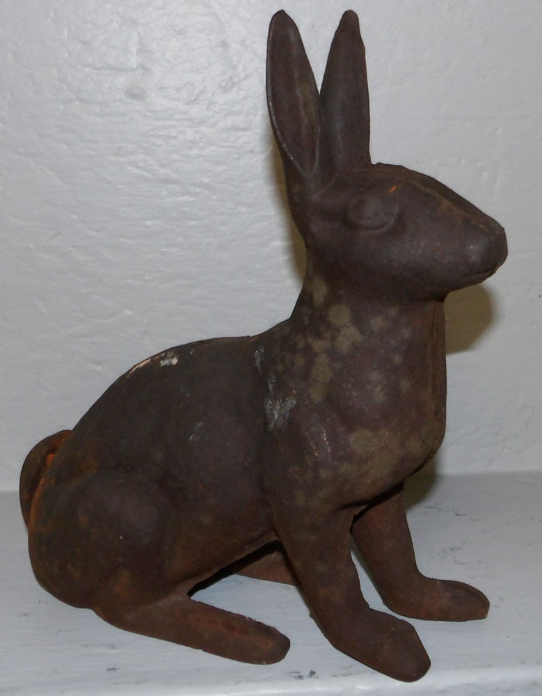 Cast Iron Bunny Door Stop: Cast Iron Bunny Door Stop. 11 3/4" H 11 1/2" W 5 1/2" D ALL DESCRIPTIONS AND ANY CONDITION STATEMENT GIVEN BY LANGSTON AUCTION GALLERY ARE STRICTLY OPINIONS AND LANGSTON'S SHALL HAVE NO RESPONSIBILITY