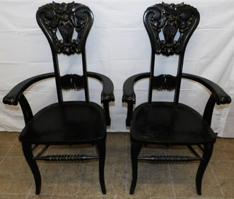 Pair of Black Lacquered Carved Oak Arm Chairs with Open Mouth Lion Face Backs