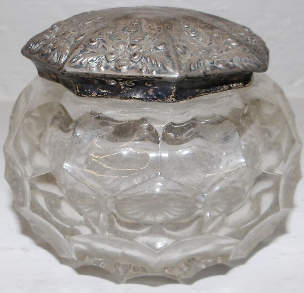 Glass Powder Jar With Sterling Top: Glass Powder Jar With Sterling Top. 3 1/4" H 4 1/4" Dia ALL DESCRIPTIONS AND ANY CONDITION STATEMENT GIVEN BY LANGSTON AUCTION GALLERY ARE STRICTLY OPINIONS AND LANGSTON'S SHALL HAVE NO RESPONSIBILITY