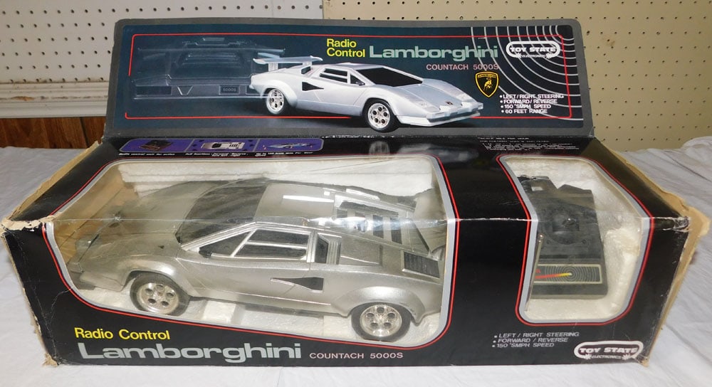 1987 Toy State Remote Control Lamborghini - NOS: 1987 Toy State Remote Control Lamborghini - NOS. 6" H 22" W 7 1/4" D ALL DESCRIPTIONS AND ANY CONDITION STATEMENT GIVEN BY LANGSTON AUCTION GALLERY ARE STRICTLY OPINIONS AND LANGSTON'S SHALL HAVE NO R