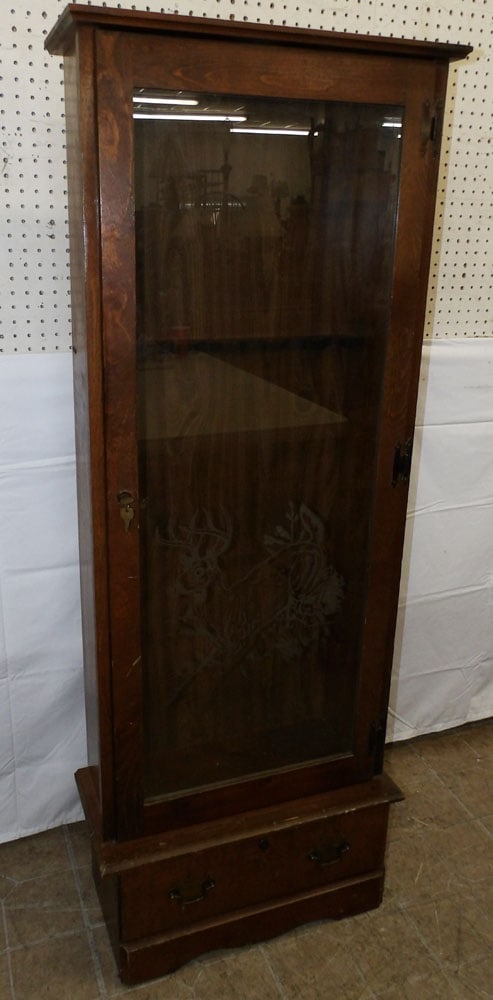 Pine Gun Cabinet With Etched Glass Door - Has Lock With Key: Pine Gun Cabinet With Etched Glass Door - Has Lock With Key. 62 3/4" H 23 3/4" W 11" H ALL DESCRIPTIONS AND ANY CONDITION STATEMENT GIVEN BY LANGSTON AUCTION GALLERY ARE STRICTLY OPINIONS AND LANGSTON