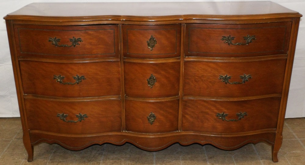 Cherry French Provincial Nine Drawer Dresser By Bassett: Cherry French Provincial Nine Drawer Dresser By Bassett. 33 1/4" H 57" W 19" D ALL DESCRIPTIONS AND ANY CONDITION STATEMENT GIVEN BY LANGSTON AUCTION GALLERY ARE STRICTLY OPINIONS AND LANGSTON'S SHALL
