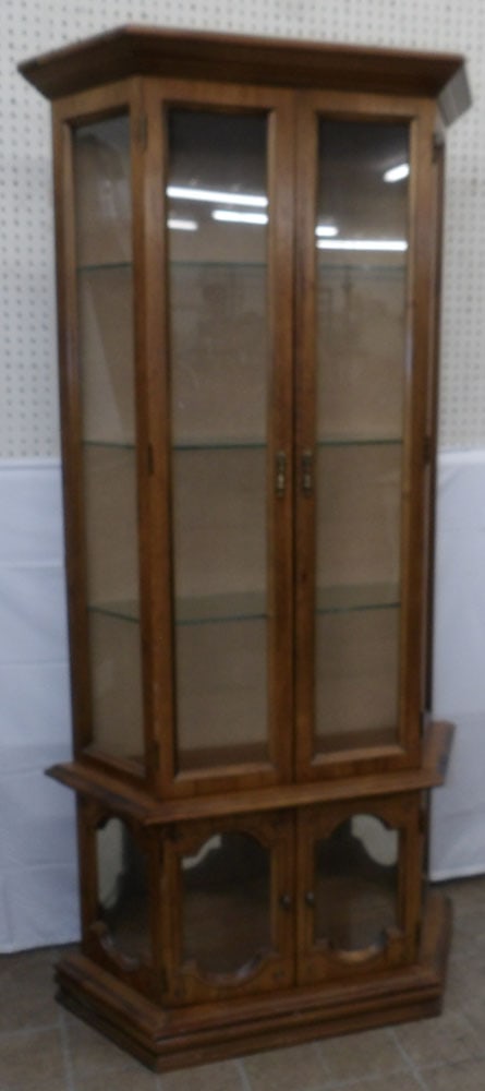 Walnut & Glass Lighted Cabinet: Walnut & Glass Lighted Cabinet. 71" H 35" W 11" D ALL DESCRIPTIONS AND ANY CONDITION STATEMENT GIVEN BY LANGSTON AUCTION GALLERY ARE STRICTLY OPINIONS AND LANGSTON'S SHALL HAVE NO RESPONSIBILITY FOR E