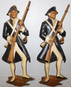 Two Painted Aluminum Revolutionary Soldier Wall Plaques