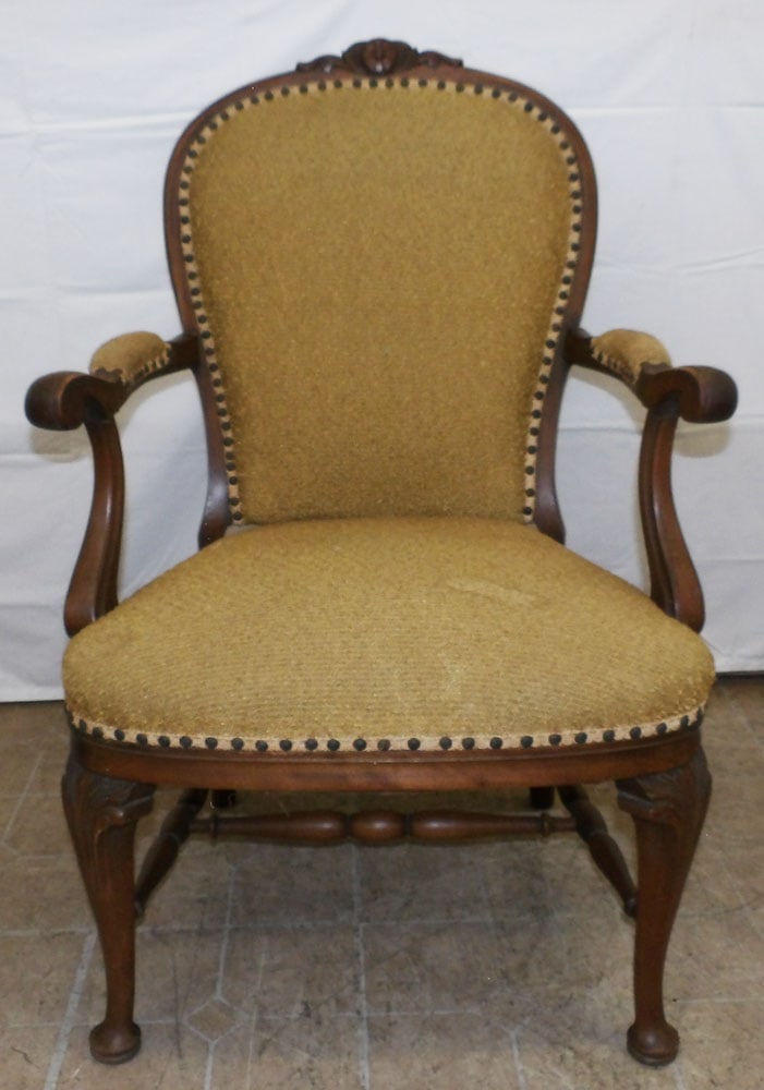 Carved Mahogany Upholstered Arm Chair: Carved Mahogany Upholstered Arm Chair. 38 1/2" H 25 1/2" W 22" D ALL DESCRIPTIONS AND ANY CONDITION STATEMENT GIVEN BY LANGSTON AUCTION GALLERY ARE STRICTLY OPINIONS AND LANGSTON'S SHALL HAVE NO RESPO