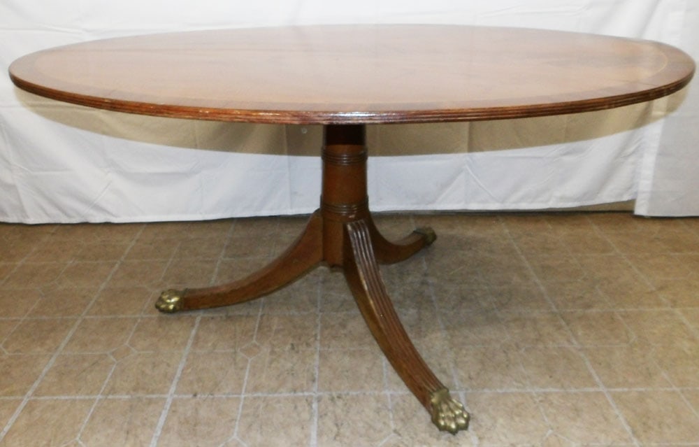 19th C Mahogany Banded Top Center Table: 19th C Mahogany Banded Top Center Table. 26" H 53 1/2" W 28" D ALL DESCRIPTIONS AND ANY CONDITION STATEMENT GIVEN BY LANGSTON AUCTION GALLERY ARE STRICTLY OPINIONS AND LANGSTON'S SHALL HAVE NO RESPONS