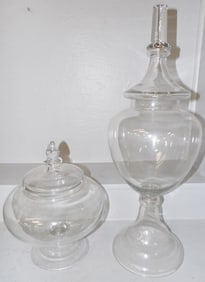 Two Glass Covered Urns