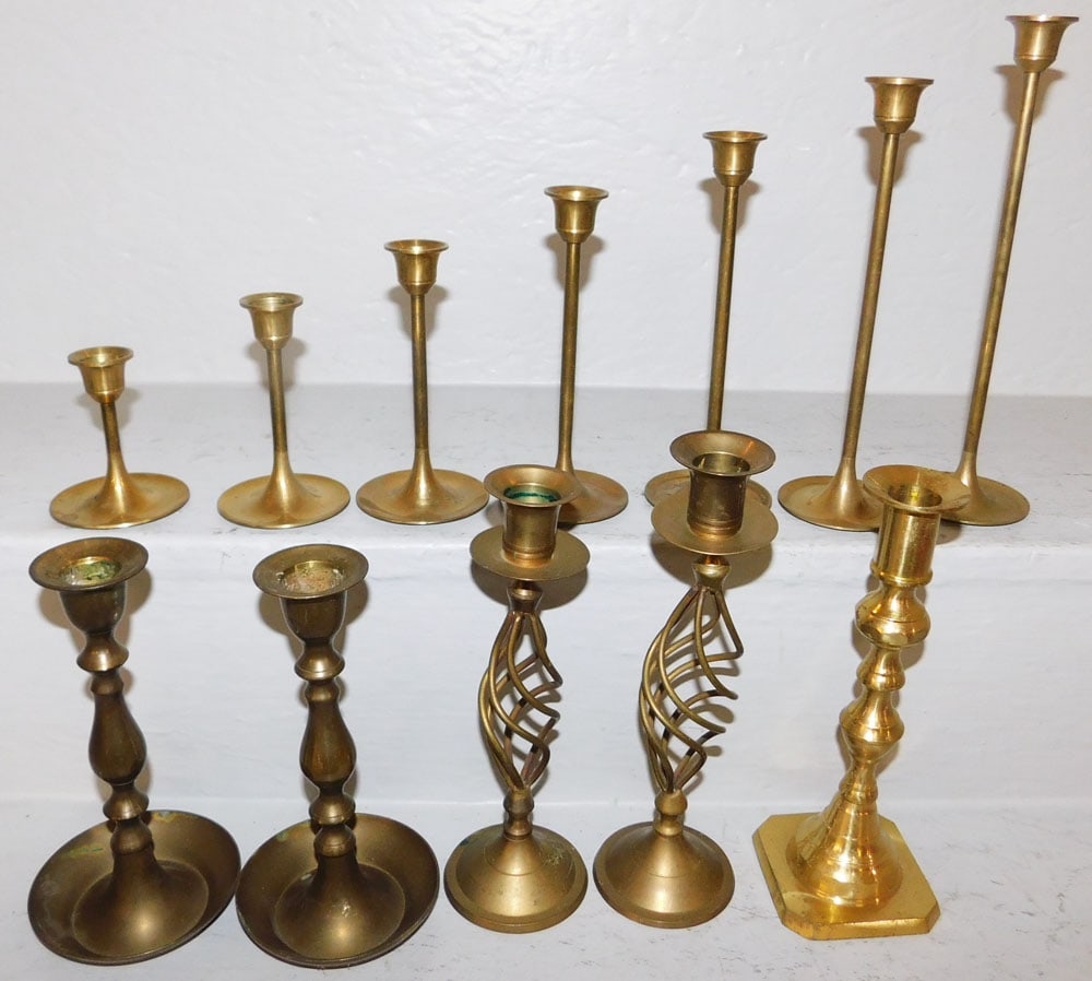 Lot Brass Candlesticks: Lot Brass Candlesticks. 8" H 3" dia ALL DESCRIPTIONS AND ANY CONDITION STATEMENT GIVEN BY LANGSTON AUCTION GALLERY ARE STRICTLY OPINIONS AND LANGSTON'S SHALL HAVE NO RESPONSIBILITY FOR ERRORS OR OMISS