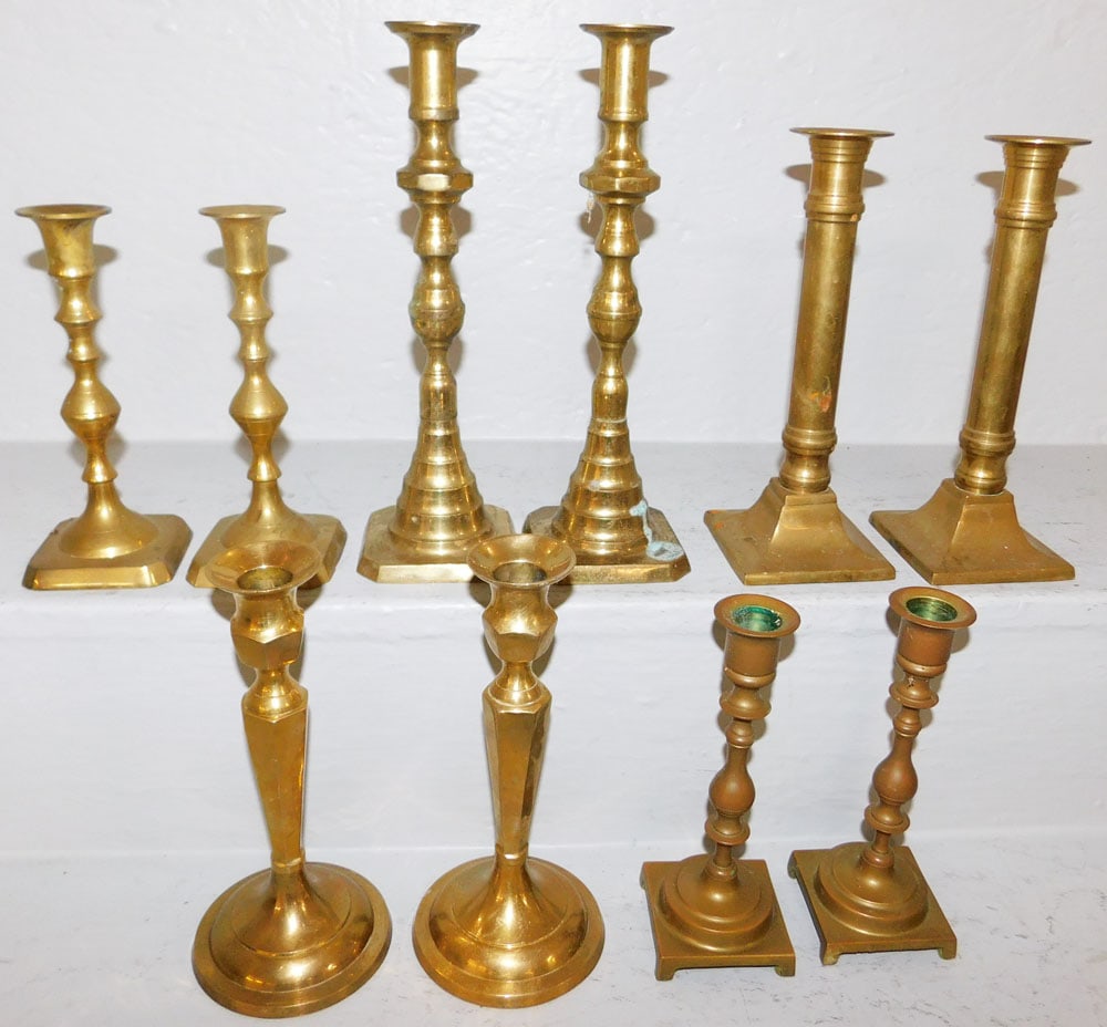 Lot Brass Candlesticks: Lot Brass Candlesticks. 10 1/4" H 3 1/4" Dia ALL DESCRIPTIONS AND ANY CONDITION STATEMENT GIVEN BY LANGSTON AUCTION GALLERY ARE STRICTLY OPINIONS AND LANGSTON'S SHALL HAVE NO RESPONSIBILITY FOR ERRORS
