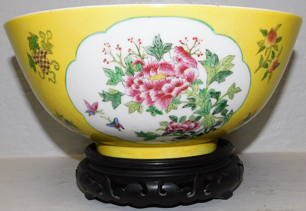 Oriental Porcelain Bowl on Teak Wood Stand : Oriental Porcelain Bowl on Teak Wood Stand . Bowl: 4 1/2" H 10 1/4" Dia. ALL DESCRIPTIONS AND ANY CONDITION STATEMENT GIVEN BY LANGSTON AUCTION GALLERY ARE STRICTLY OPINIONS AND LANGSTON'S SHALL HAVE