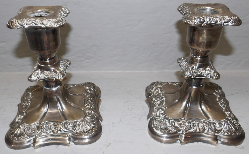 Pair of Silverplated Candlesticks : Pair of Silverplated Candlesticks . 5 1/4" H 4 1/2" Dia. ALL DESCRIPTIONS AND ANY CONDITION STATEMENT GIVEN BY LANGSTON AUCTION GALLERY ARE STRICTLY OPINIONS AND LANGSTON'S SHALL HAVE NO RESPONSIBILIT