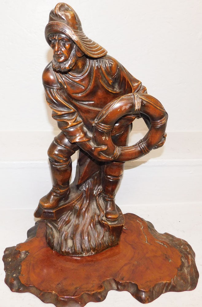 Carved Wood Fisherman Statue on Burl Wood Base: Carved Wood Fisherman Statue on Burl Wood Base. 21" H 10 1/2" W ALL DESCRIPTIONS AND ANY CONDITION STATEMENT GIVEN BY LANGSTON AUCTION GALLERY ARE STRICTLY OPINIONS AND LANGSTON'S SHALL HAVE NO RESPON