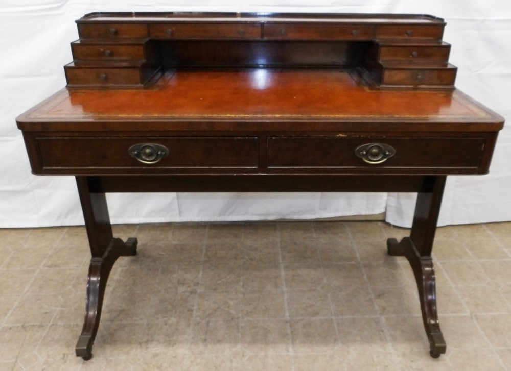 Mahogany & Tooled Leather Top Ladies Desk by Baker: Mahogany & Tooled Leather Top Ladies Desk by Baker. 35" H 42 1/4" W 24" D ALL DESCRIPTIONS AND ANY CONDITION STATEMENT GIVEN BY LANGSTON AUCTION GALLERY ARE STRICTLY OPINIONS AND LANGSTON'S SHALL HAVE