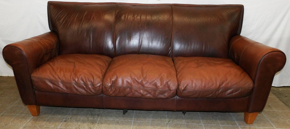 Leather Upholstered Sofa : Leather Upholstered Sofa . 38 1/2" H 88" W 33" D ALL DESCRIPTIONS AND ANY CONDITION STATEMENT GIVEN BY LANGSTON AUCTION GALLERY ARE STRICTLY OPINIONS AND LANGSTON'S SHALL HAVE NO RESPONSIBILITY FOR ER