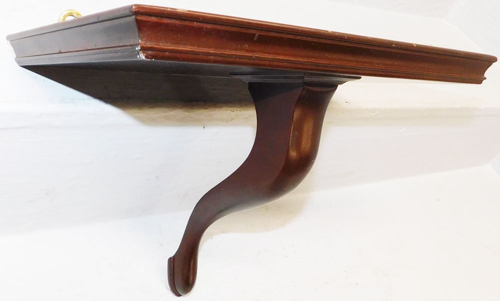 Mahogany Wall Bracket by Colonial Williamsburg : Mahogany Wall Bracket by Colonial Williamsburg . 9" H 12 1/2" W 7 3/4" D ALL DESCRIPTIONS AND ANY CONDITION STATEMENT GIVEN BY LANGSTON AUCTION GALLERY ARE STRICTLY OPINIONS AND LANGSTON'S SHALL HAVE 