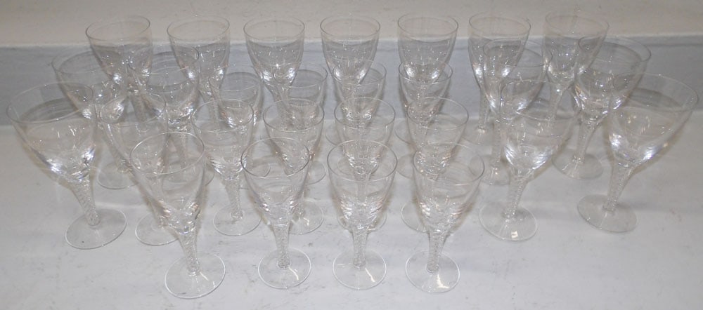 27 Pieces of Signed Stuart Hollow Swirl Stemware : 27 Pieces of Signed Stuart Hollow Swirl Stemware . 7 1/2" H 3 1/2" Dia ALL DESCRIPTIONS AND ANY CONDITION STATEMENT GIVEN BY LANGSTON AUCTION GALLERY ARE STRICTLY OPINIONS AND LANGSTON'S SHALL HAVE NO