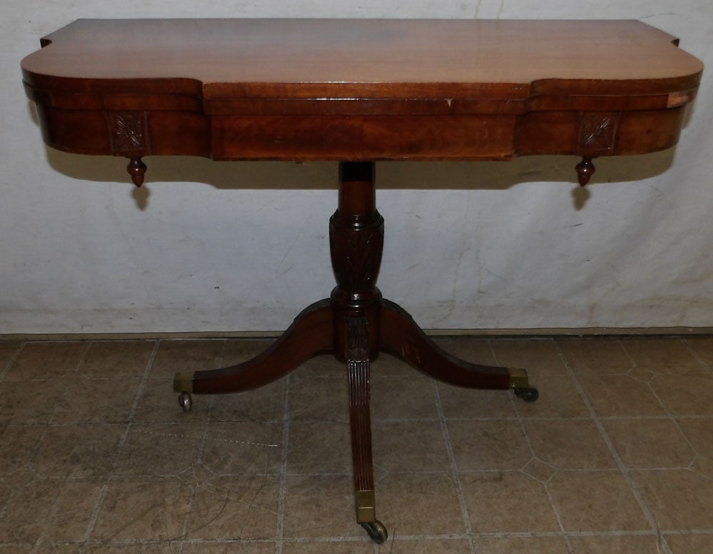 19th Century Fold Over Top Mahogany Game Table: 19th Century Fold Over Top Mahogany Game Table. 28 1/4" H 36" W 18" D ALL DESCRIPTIONS AND ANY CONDITION STATEMENT GIVEN BY LANGSTON AUCTION GALLERY ARE STRICTLY OPINIONS AND LANGSTON'S SHALL HAVE NO 