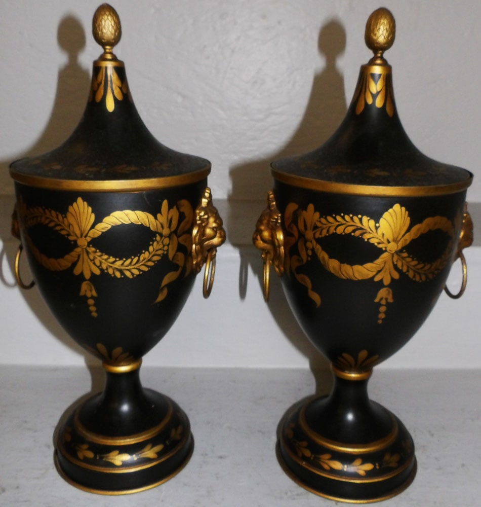 Pair of Painted Tole Covered Urns with Lion Head Handles : Pair of Painted Tole Covered Urns with Lion Head Handles . 15" H 6 1/2" Dia ALL DESCRIPTIONS AND ANY CONDITION STATEMENT GIVEN BY LANGSTON AUCTION GALLERY ARE STRICTLY OPINIONS AND LANGSTON'S SHALL HA
