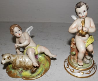 Two Capodimonte Porcelain Cherub Figurines