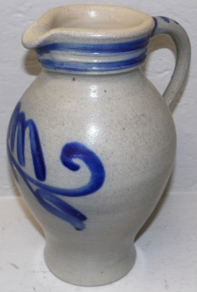 Blue Decorated Stoneware Pitcher: Blue Decorated Stoneware Pitcher. 10 3/4" H 7 1/2" W ALL DESCRIPTIONS AND ANY CONDITION STATEMENT GIVEN BY LANGSTON AUCTION GALLERY ARE STRICTLY OPINIONS AND LANGSTON'S SHALL HAVE NO RESPONSIBILITY FO