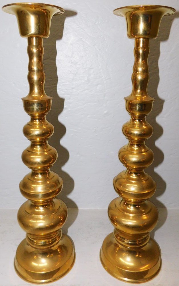 Pair of Brass Candlesticks : Pair of Brass Candlesticks . 17 1/2" H 4 3/4" Dia. ALL DESCRIPTIONS AND ANY CONDITION STATEMENT GIVEN BY LANGSTON AUCTION GALLERY ARE STRICTLY OPINIONS AND LANGSTON'S SHALL HAVE NO RESPONSIBILITY FOR