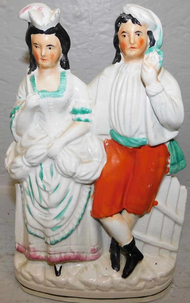 Antique Staffordshire Figure of Lady & Man: Antique Staffordshire Figure of Lady & Man. 10 1/4" H 6" W ALL DESCRIPTIONS AND ANY CONDITION STATEMENT GIVEN BY LANGSTON AUCTION GALLERY ARE STRICTLY OPINIONS AND LANGSTON'S SHALL HAVE NO RESPONSIBIL