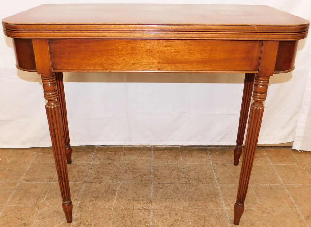 Mahogany Fold Over Top Game Table : Mahogany Fold Over Top Game Table . 30" H 36" W 18" D ALL DESCRIPTIONS AND ANY CONDITION STATEMENT GIVEN BY LANGSTON AUCTION GALLERY ARE STRICTLY OPINIONS AND LANGSTON'S SHALL HAVE NO RESPONSIBILITY F