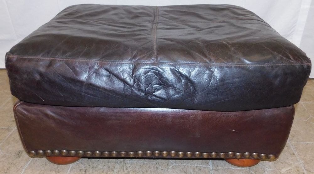Leather Upholstered Ottoman: Leather Upholstered Ottoman. 16" H 32" W 25 1/2" D ALL DESCRIPTIONS AND ANY CONDITION STATEMENT GIVEN BY LANGSTON AUCTION GALLERY ARE STRICTLY OPINIONS AND LANGSTON'S SHALL HAVE NO RESPONSIBILITY FOR 