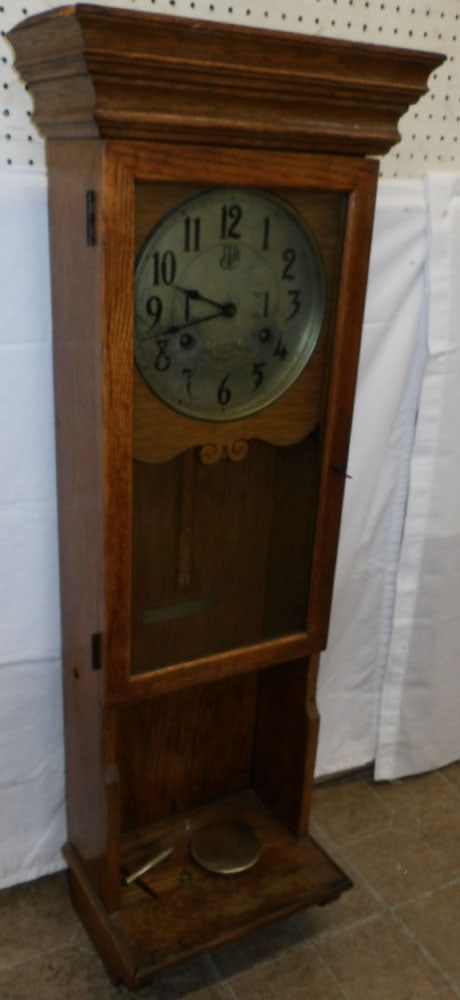 Antique Oak Wall Clock by International Time Recording Company, (Pendulum Rod As Is): Antique Oak Wall Clock by International Time Recording Company, (Pendulum Rod As Is). 48 1/4" H 17 1/4" W 8" D ALL DESCRIPTIONS AND ANY CONDITION STATEMENT GIVEN BY LANGSTON AUCTION GALLERY ARE STRICT
