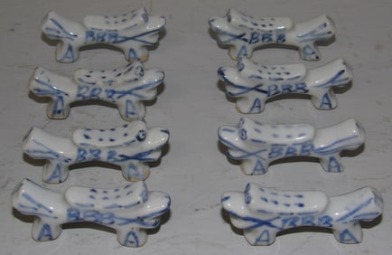 Lot of Eight Antique Blue & White Foo Dog Knife Rests