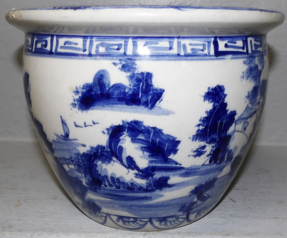 Oriental Blue & White Porcelain Jardiniere: Oriental Blue & White Porcelain Jardiniere . 6 3/4" H 8 3/4" Dia. "ALL DESCRIPTIONS AND ANY CONDITION STATEMENT GIVEN BY LANGSTON AUCTION GALLERY ARE STRICTLY OPINIONS AND LANGSTON'S SHALL HAVE NO RES