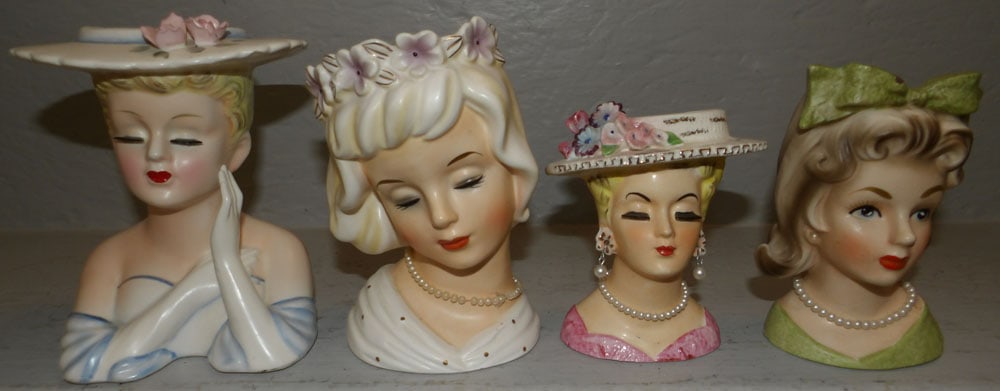 Four Hand Painted Porcelain Lady Head Vases: Four Hand Painted Porcelain Lady Head Vases. Up to 6 1/4" H 5" W "ALL DESCRIPTIONS AND ANY CONDITION STATEMENT GIVEN BY LANGSTON AUCTION GALLERY ARE STRICTLY OPINIONS AND LANGSTON'S SHALL HAVE NO RESP