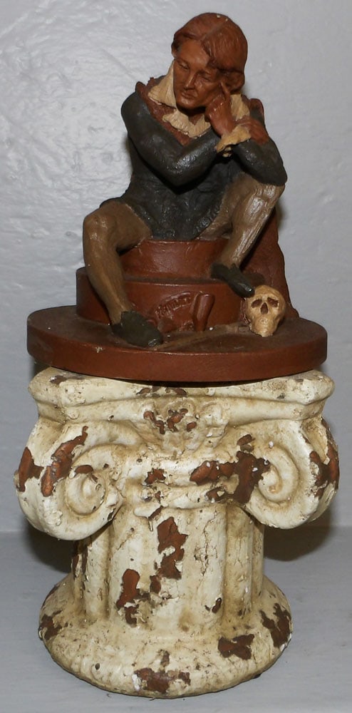 1983 Tom Clark Figure "Hamlet" & Ceramic Stand: 1983 Tom Clark Figure "Hamlet" & Ceramic Stand . Up to 6 3/4" H 7" Dia. "ALL DESCRIPTIONS AND ANY CONDITION STATEMENT GIVEN BY LANGSTON AUCTION GALLERY ARE STRICTLY OPINIONS AND LANGSTON'S SHALL HAVE