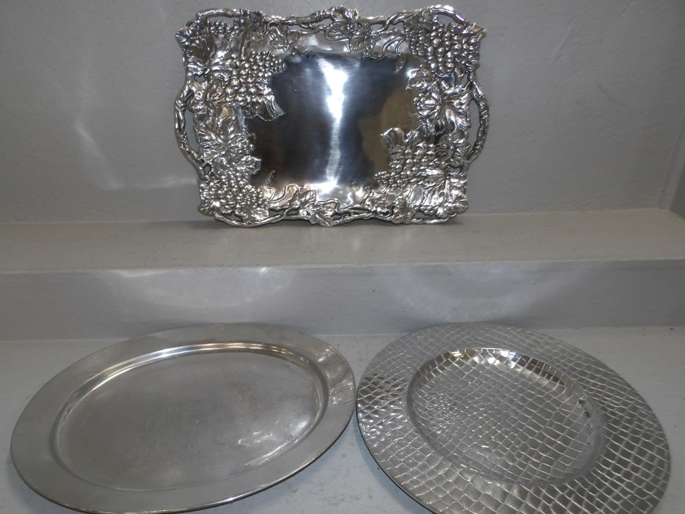Three Cast Aluminum Platters: Three Cast Aluminum Platters . Up to 24" x 16 1/4" "ALL DESCRIPTIONS AND ANY CONDITION STATEMENT GIVEN BY LANGSTON AUCTION GALLERY ARE STRICTLY OPINIONS AND LANGSTON'S SHALL HAVE NO RESPONSIBILITY FOR