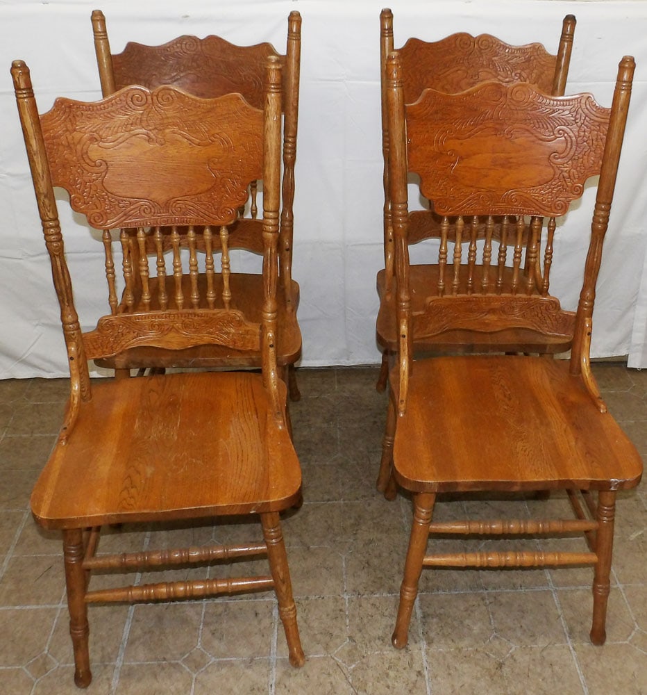 Set of Four Oak Press Back Dining Chairs: Set of Four Oak Press Back Dining Chairs . 42" H 17 1/2" W 17" D "ALL DESCRIPTIONS AND ANY CONDITION STATEMENT GIVEN BY LANGSTON AUCTION GALLERY ARE STRICTLY OPINIONS AND LANGSTON'S SHALL HAVE NO RESP