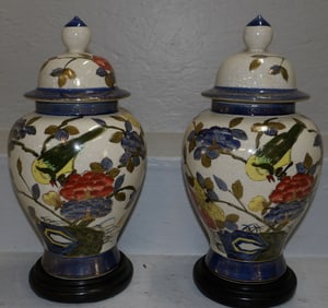 Pair of Oriental Painted Porcelain Covered Urns With Bird Motif on Teak Wood Stands