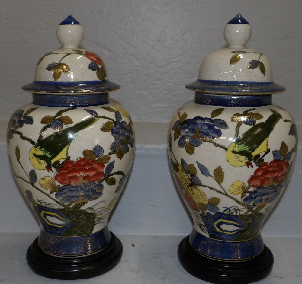 Pair of Oriental Painted Porcelain Covered Urns With Bird Motif on Teak Wood Stands: Pair of Oriental Painted Porcelain Covered Urns With Bird Motif on Teak Wood Stands . 13" H 6" Dia "ALL DESCRIPTIONS AND ANY CONDITION STATEMENT GIVEN BY LANGSTON AUCTION GALLERY ARE STRICTLY OPINIONS