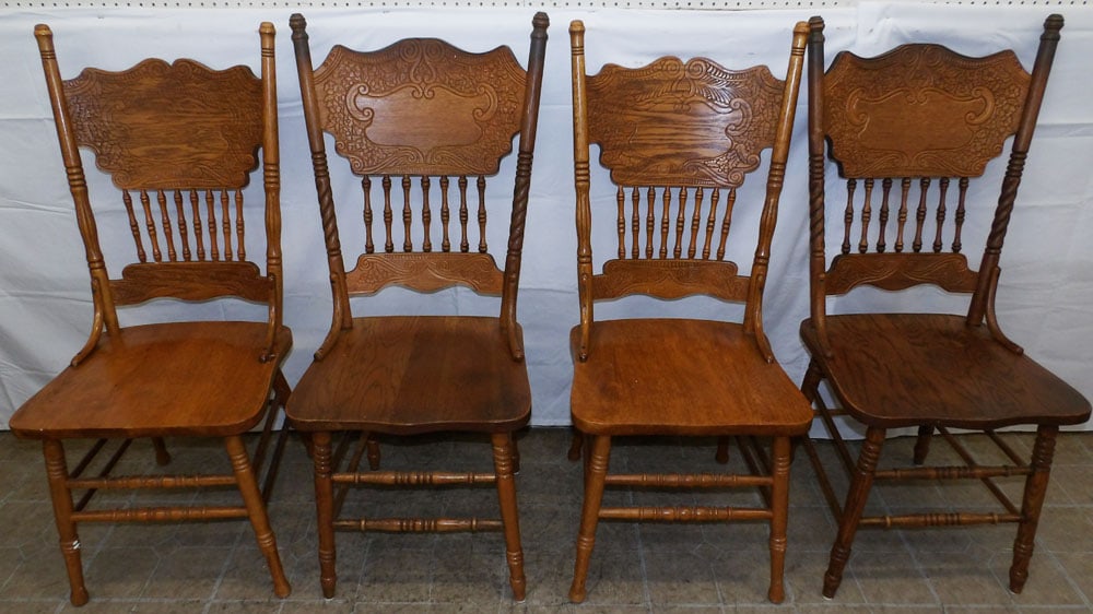 Set of Four Oak Press Back Dining Chairs: Set of Four Oak Press Back Dining Chairs . 42 1/2" H 18" W 18 1/2" D "ALL DESCRIPTIONS AND ANY CONDITION STATEMENT GIVEN BY LANGSTON AUCTION GALLERY ARE STRICTLY OPINIONS AND LANGSTON'S SHALL HAVE NO