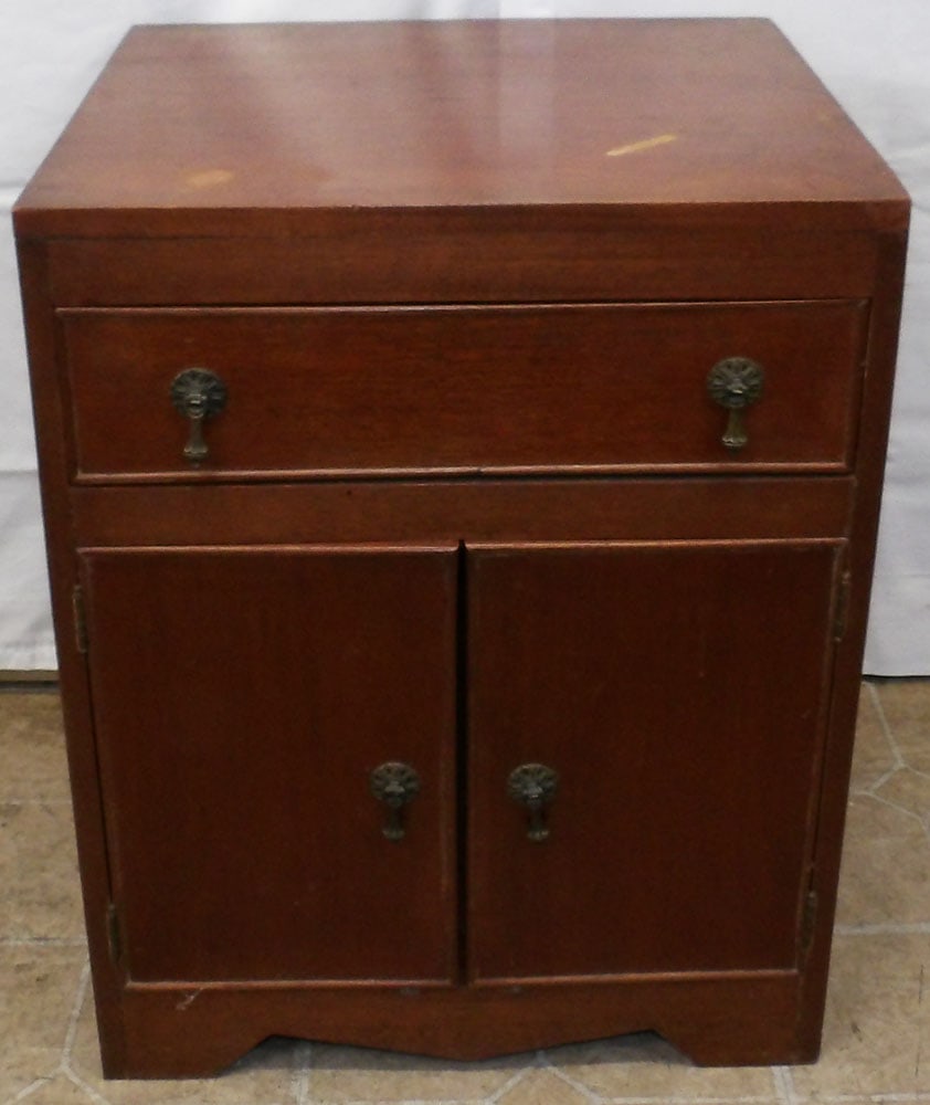 Walnut Two Drawer Stand with One Door: Walnut Two Drawer Stand with One Door. 23" H 17 3/4" W 15 3/4" D "ALL DESCRIPTIONS AND ANY CONDITION STATEMENT GIVEN BY LANGSTON AUCTION GALLERY ARE STRICTLY OPINIONS AND LANGSTON'S SHALL HAVE NO RESP