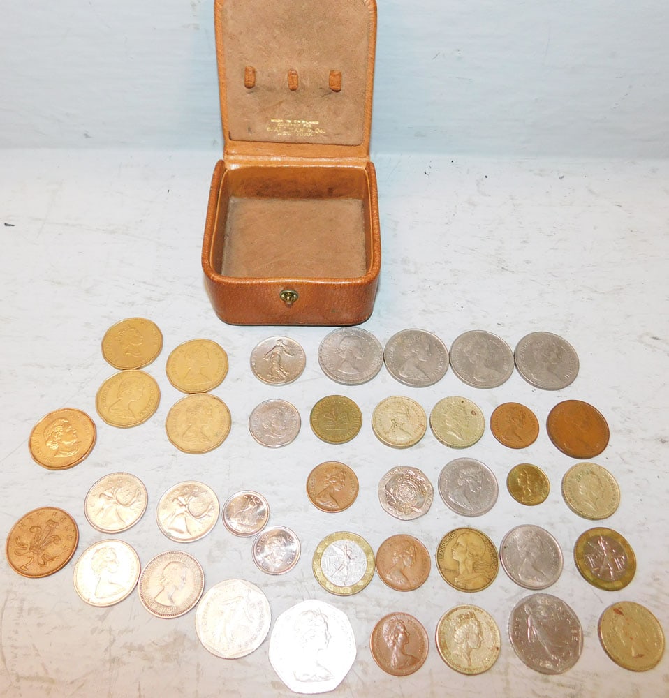 Lot of Foreign Coins in Leather Case: Lot of Foreign Coins in Leather Case . 3" X 3" "ALL DESCRIPTIONS AND ANY CONDITION STATEMENT GIVEN BY LANGSTON AUCTION GALLERY ARE STRICTLY OPINIONS AND LANGSTON'S SHALL HAVE NO RESPONSIBILITY FOR ERR
