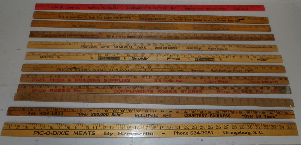 Twelve Vintage Advertising Yard Sticks: Twelve Vintage Advertising Yard Sticks. 36" L "ALL DESCRIPTIONS AND ANY CONDITION STATEMENT GIVEN BY LANGSTON AUCTION GALLERY ARE STRICTLY OPINIONS AND LANGSTON'S SHALL HAVE NO RESPONSIBILITY FOR